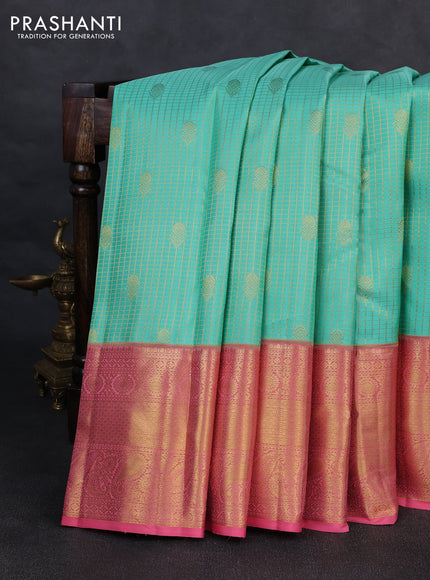 Pure kanchipurams silk saree teal blue and peach pink with allover small zari checks & buttas and long zari woven border