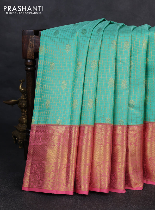 Pure kanchipurams silk saree teal blue and peach pink with allover small zari checks & buttas and long zari woven border