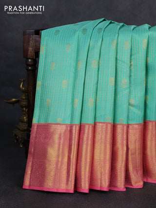 Pure kanchipurams silk saree teal blue and peach pink with allover small zari checks & buttas and long zari woven border