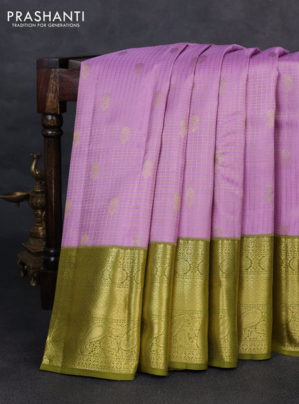 Pure kanchipurams silk saree lavender and mehendi green with allover small zari checks & buttas and long zari woven border