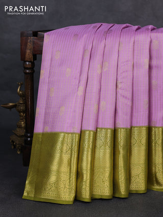 Pure kanchipurams silk saree lavender and mehendi green with allover small zari checks & buttas and long zari woven border
