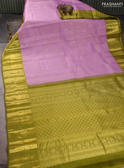 Pure kanchipurams silk saree lavender and mehendi green with allover small zari checks & buttas and long zari woven border