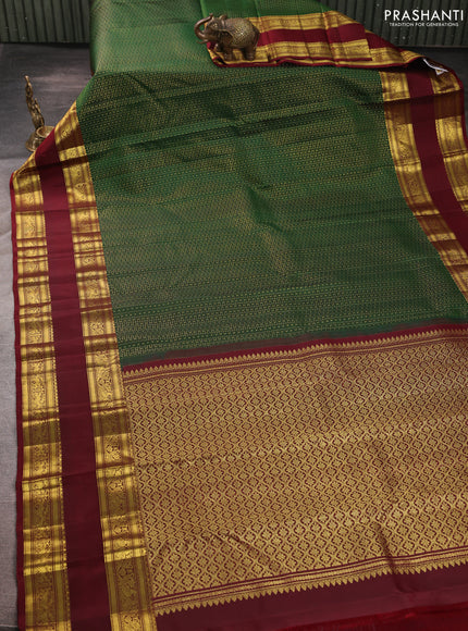 Pure kanchipurams silk saree green and maroon with allover small zari checks & buttas and rettapet zari woven border