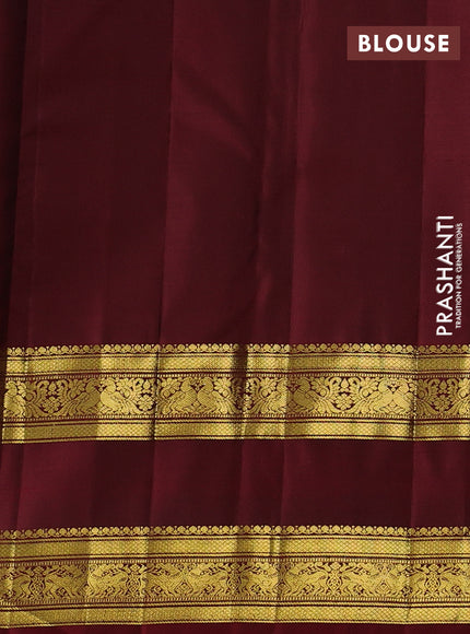 Pure kanchipurams silk saree green and maroon with allover small zari checks & buttas and rettapet zari woven border