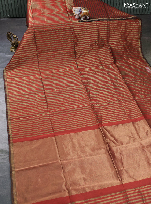 Maheswari silk cotton saree rust shade with allover stripe pattern and zari woven border