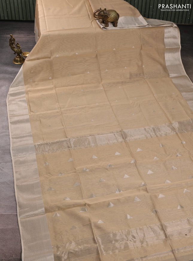 Maheswari silk cotton saree beige with silver zari woven geometric buttas and zari woven border