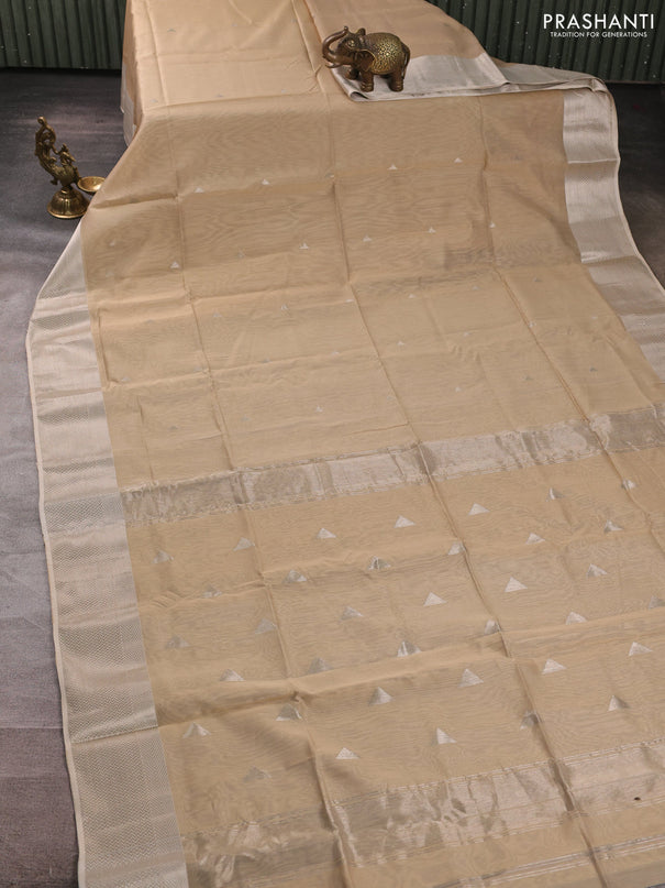 Maheswari silk cotton saree beige with silver zari woven geometric buttas and zari woven border