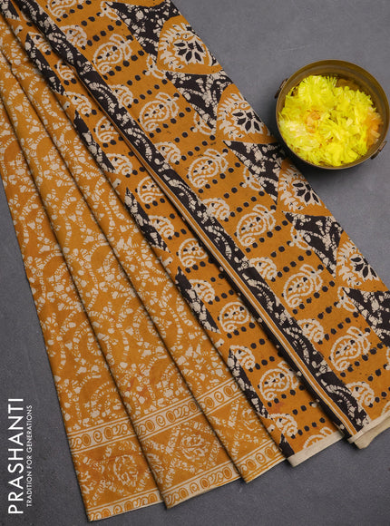 Kalamkari cotton saree mustard yellow with allover prints and printed border