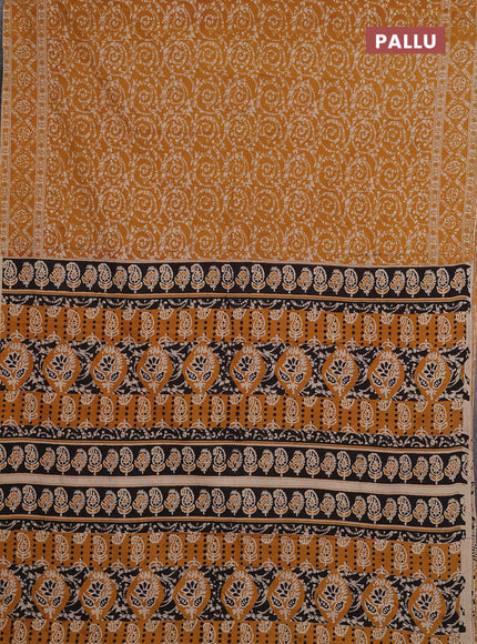 Kalamkari cotton saree mustard yellow with allover prints and printed border
