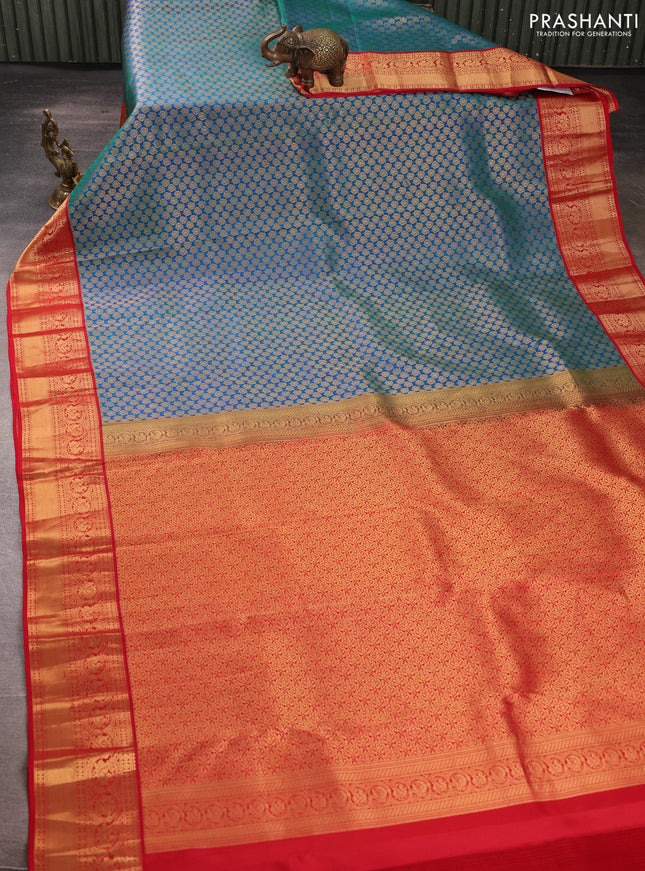 Pure kanchipuram silk saree dual shade of bluish green and red with allover zari woven brocade weaves and rich zari woven korvai border