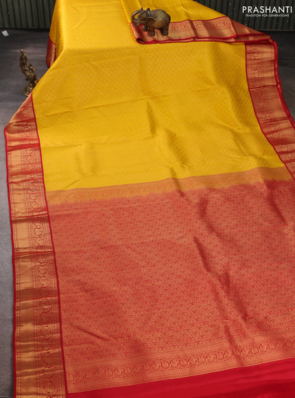 Pure kanchipuram silk saree yellow and red with allover zari woven brocade weaves and rich zari woven korvai border