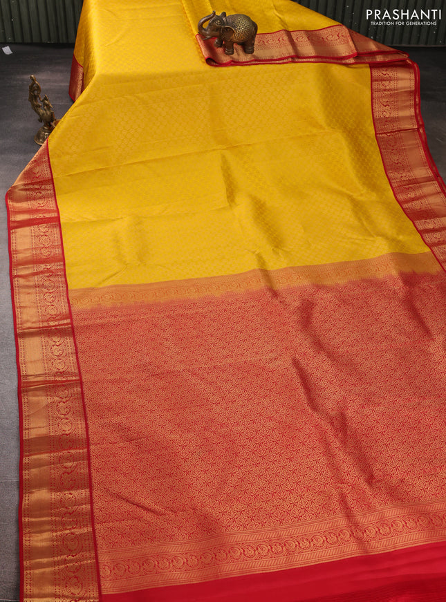 Pure kanchipuram silk saree yellow and red with allover zari woven brocade weaves and rich zari woven korvai border