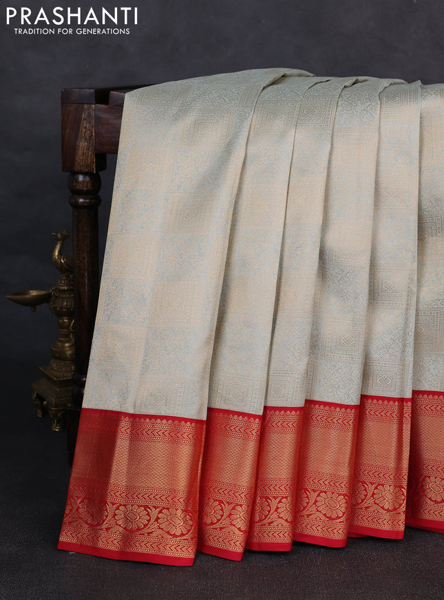 Pure kanchipuram silk saree pastel blue shade and red with allover zari woven brocade weaves and rich zari woven korvai border