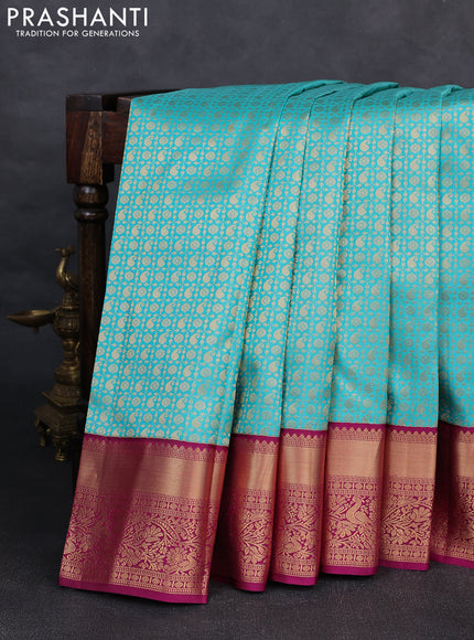 Pure kanchipuram silk saree teal blue and magenta pink with allover zari woven brocade weaves and rich zari woven korvai border