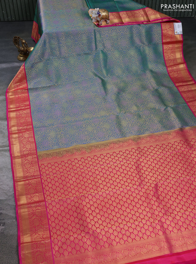 Pure kanchipuram silk saree dual shade of bluish green and pink with allover zari woven brocade weaves and rich zari woven korvai border