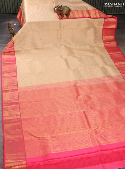 Pure kanchipuram silk saree cream and peach pink with allover zari woven brocade weaves and rich zari woven korvai border