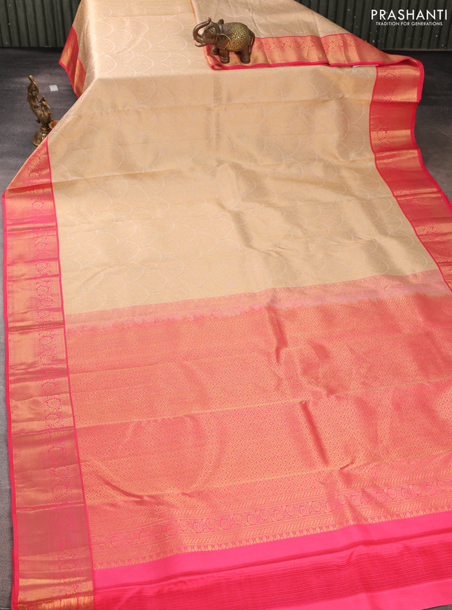 Pure kanchipuram silk saree cream and peach pink with allover zari woven brocade weaves and rich zari woven korvai border