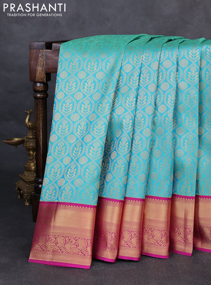 Pure kanchipuram silk saree teal blue and magenta pink with allover zari woven brocade weaves and rich zari woven korvai border