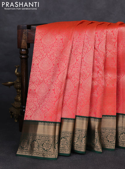 Pure kanchipuram silk saree peach orange and bottle green with allover zari woven brocade weaves and rich zari woven korvai border