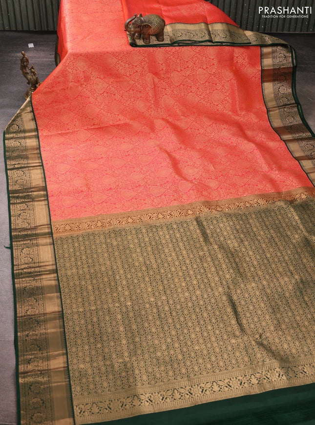 Pure kanchipuram silk saree peach orange and bottle green with allover zari woven brocade weaves and rich zari woven korvai border