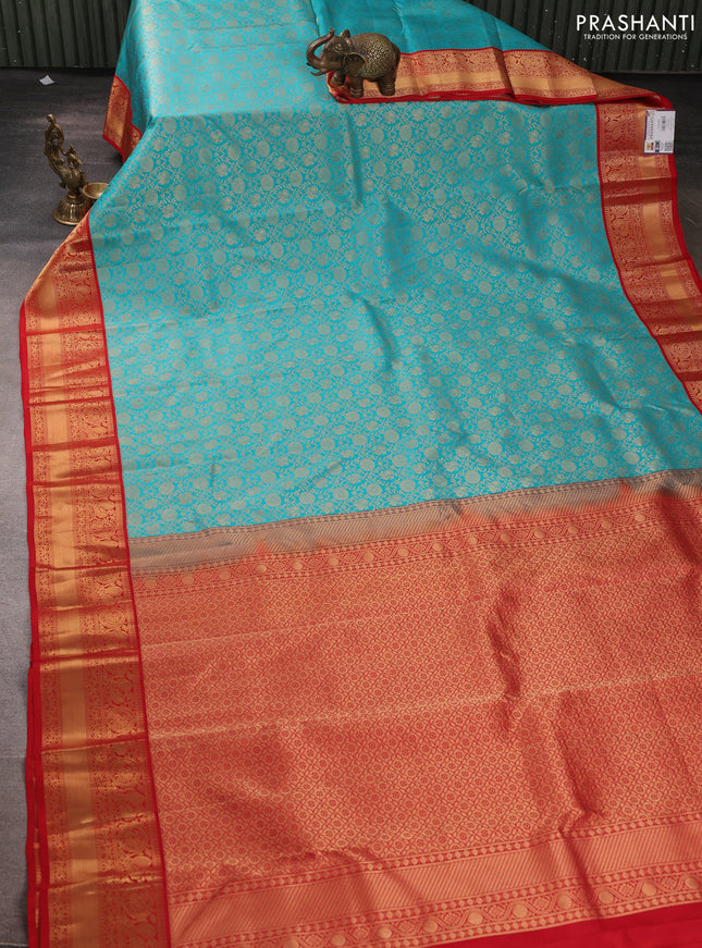Pure kanchipuram silk saree teal blue and red with allover zari woven brocade weaves and rich zari woven korvai border