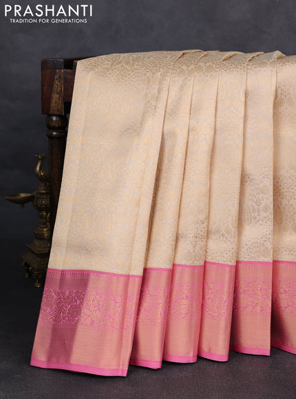 Pure kanchipuram silk saree cream and light pink with allover zari woven brocade weaves and rich zari woven korvai border