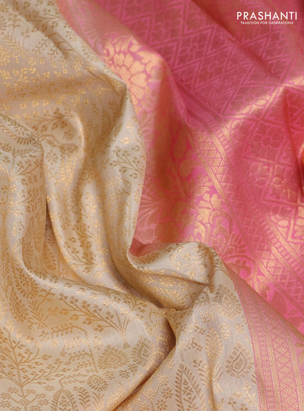Pure kanchipuram silk saree cream and light pink with allover zari woven brocade weaves and rich zari woven korvai border