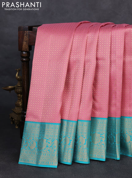 Pure kanchipuram silk saree peach pink and teal blue with allover zari woven brocade weaves and rich zari woven korvai border