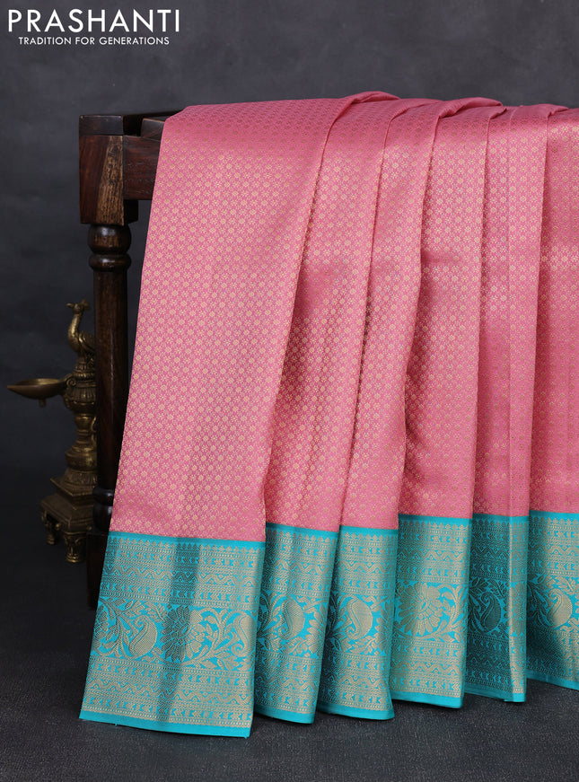 Pure kanchipuram silk saree peach pink and teal blue with allover zari woven brocade weaves and rich zari woven korvai border