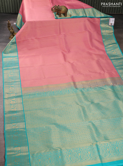 Pure kanchipuram silk saree peach pink and teal blue with allover zari woven brocade weaves and rich zari woven korvai border