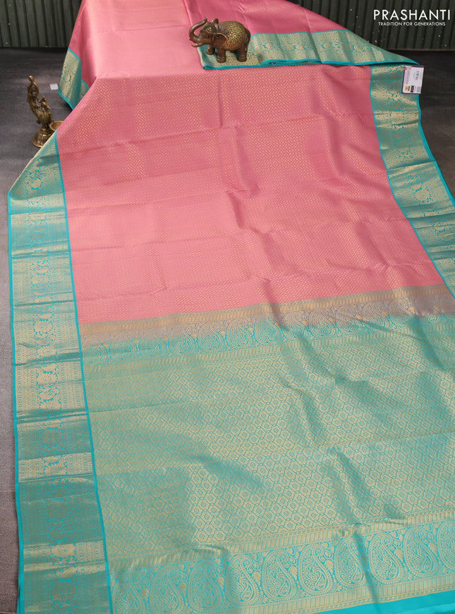 Pure kanchipuram silk saree peach pink and teal blue with allover zari woven brocade weaves and rich zari woven korvai border