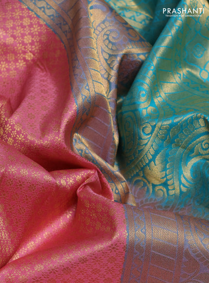 Pure kanchipuram silk saree peach pink and teal blue with allover zari woven brocade weaves and rich zari woven korvai border