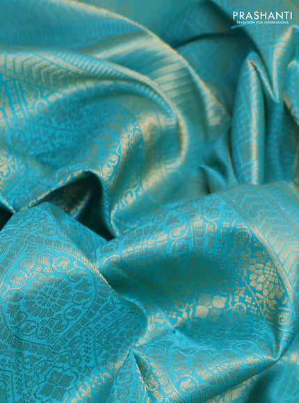 Pure kanchipuram silk saree teal blue with allover zari woven brocade weaves and rich zari woven border