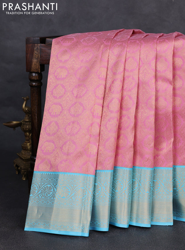 Pure kanchipuram silk saree light pink and light blue with allover zari woven brocade weaves and rich zari woven korvai border