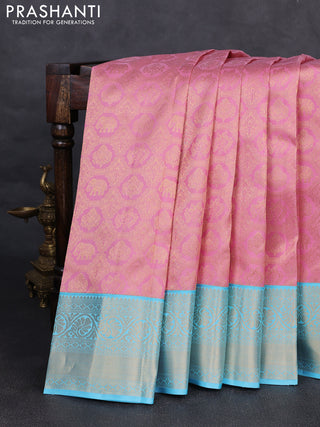 Pure kanchipuram silk saree light pink and light blue with allover zari woven brocade weaves and rich zari woven korvai border