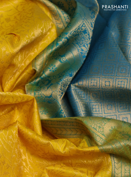 Pure kanchipuram silk saree yellow and cs blue with allover zari woven brocade weaves and rich zari woven korvai border