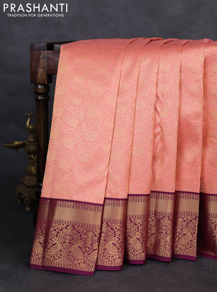 Pure kanchipuram silk saree peach shade and purple with allover zari woven brocade weaves and rich zari woven korvai border