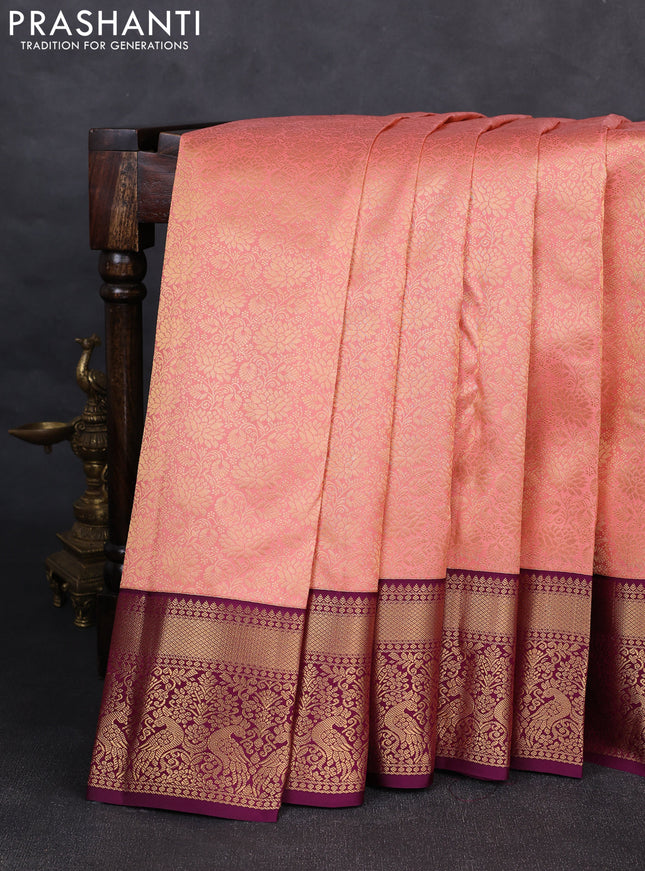 Pure kanchipuram silk saree peach shade and purple with allover zari woven brocade weaves and rich zari woven korvai border