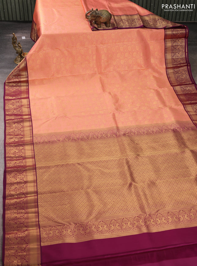 Pure kanchipuram silk saree peach shade and purple with allover zari woven brocade weaves and rich zari woven korvai border