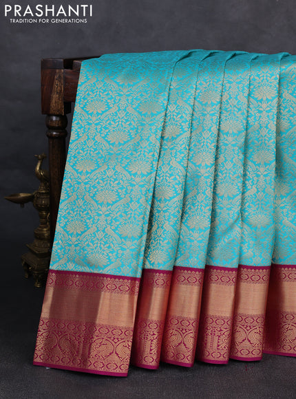 Pure kanchipuram silk saree teal blue and purple with allover zari woven brocade weaves and rich zari woven korvai border