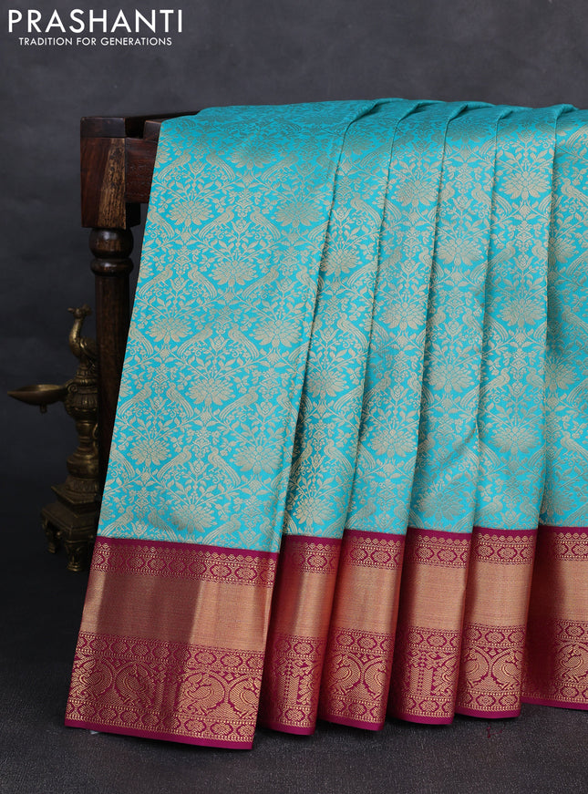 Pure kanchipuram silk saree teal blue and purple with allover zari woven brocade weaves and rich zari woven korvai border