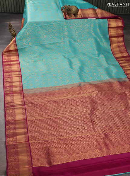 Pure kanchipuram silk saree teal blue and purple with allover zari woven brocade weaves and rich zari woven korvai border