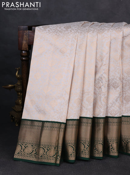 Pure kanchipuram silk saree off white and green with allover zari woven brocade weaves and rich zari woven korvai border