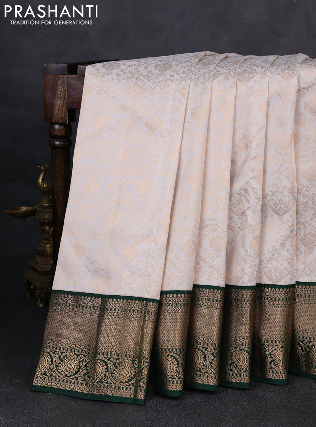 Pure kanchipuram silk saree off white and green with allover zari woven brocade weaves and rich zari woven korvai border
