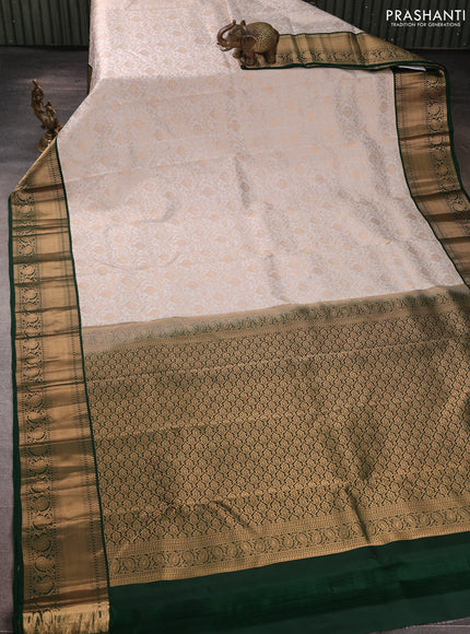 Pure kanchipuram silk saree off white and green with allover zari woven brocade weaves and rich zari woven korvai border