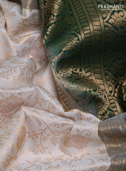 Pure kanchipuram silk saree off white and green with allover zari woven brocade weaves and rich zari woven korvai border