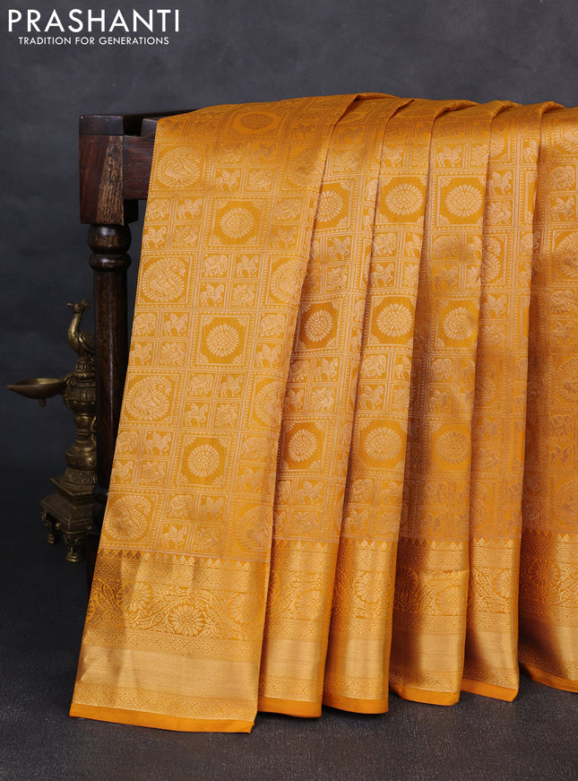 Pure kanchipuram silk saree mustard yellow with allover zari woven brocade weaves and rich zari woven border