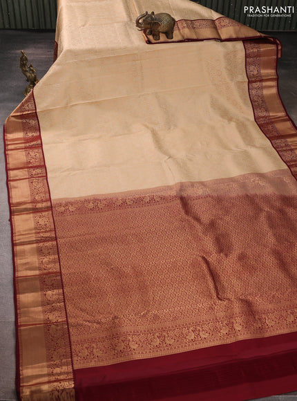 Pure kanchipuram silk saree cream and deep maroon with allover zari woven brocade weaves and rich zari woven korvai border