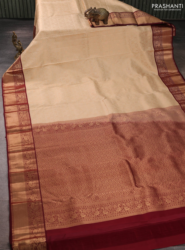 Pure kanchipuram silk saree cream and deep maroon with allover zari woven brocade weaves and rich zari woven korvai border