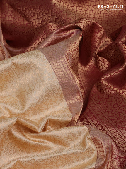 Pure kanchipuram silk saree cream and deep maroon with allover zari woven brocade weaves and rich zari woven korvai border